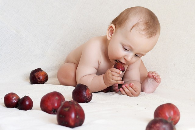 a baby eating fruits